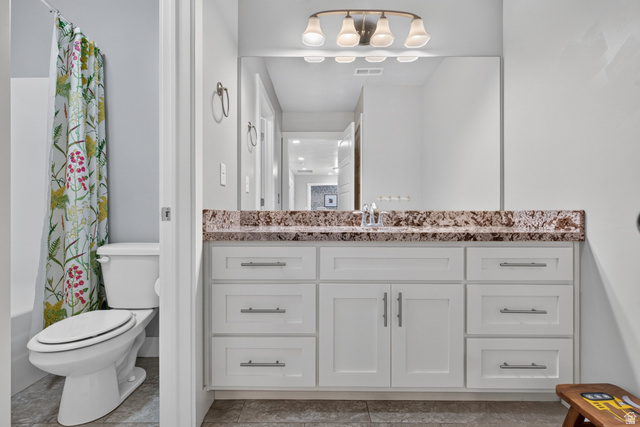 1263 East 1200th South Springville, UT 84663 - Photo 25 of 60 Bathroom vanity with a brown speckled countertop, an undermount sink, and white cabinetry