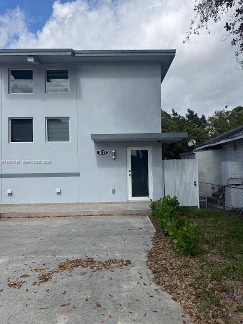 3127 Northwest 60th Street Miami, FL 33142 - Photo 1 of 13 a front view of a house with a yard