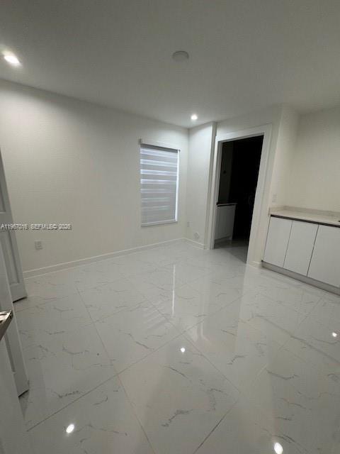 3127 Northwest 60th Street Miami, FL 33142 - Photo 2 of 13 an empty room with windows