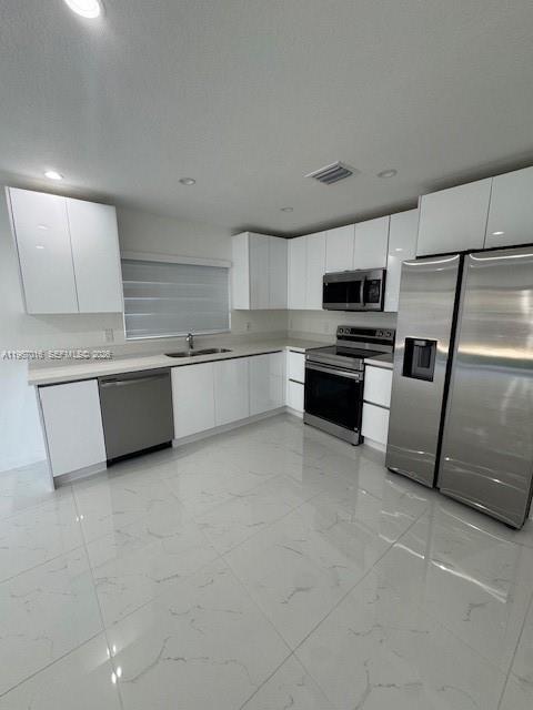 3127 Northwest 60th Street Miami, FL 33142 - Photo 6 of 13 a kitchen with a refrigerator and a sink