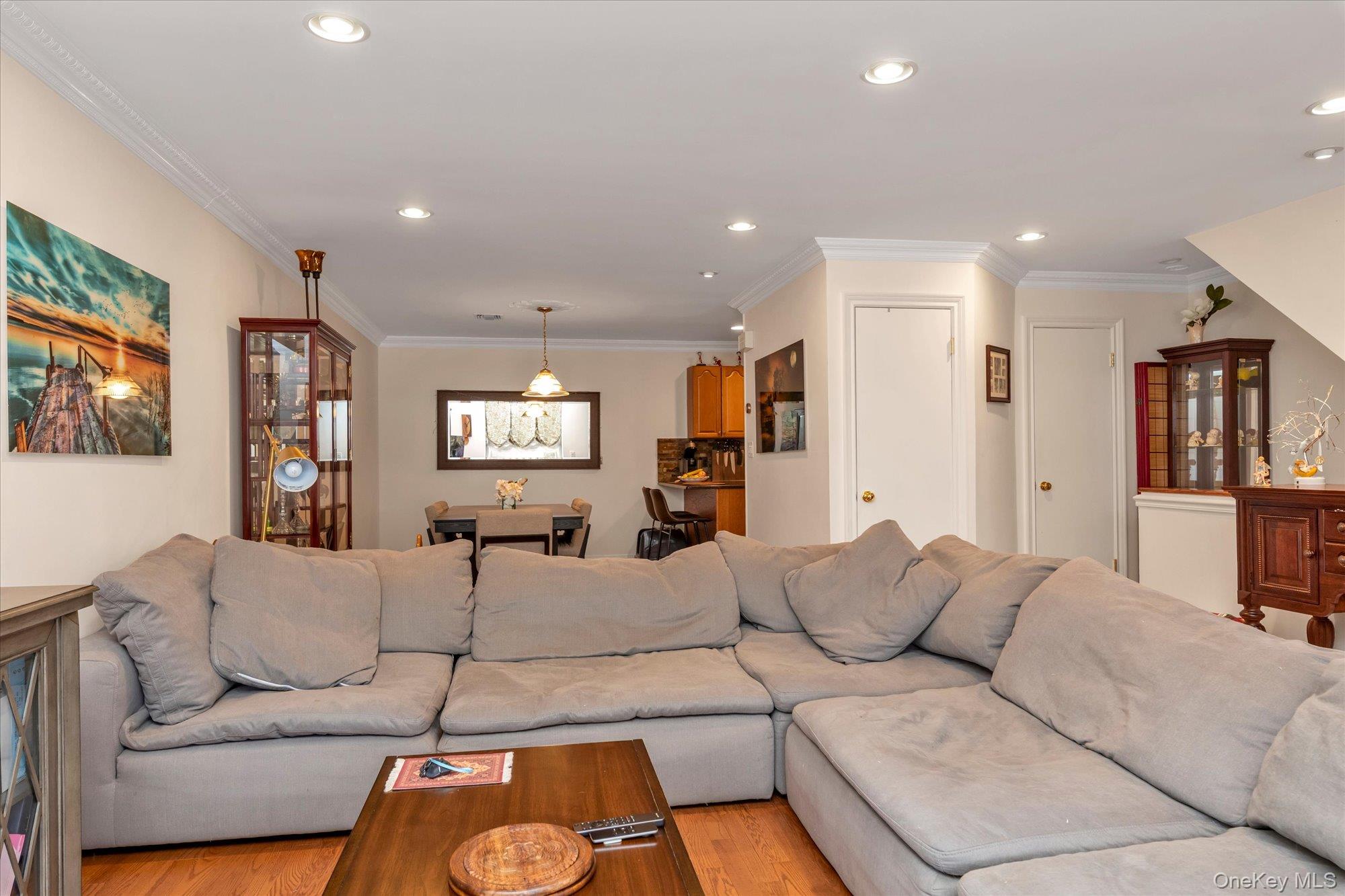 150 I U Willets Road Albertson, NY 11507 - Photo 5 of 21 Open concept main living space with Living room leading to dining room.