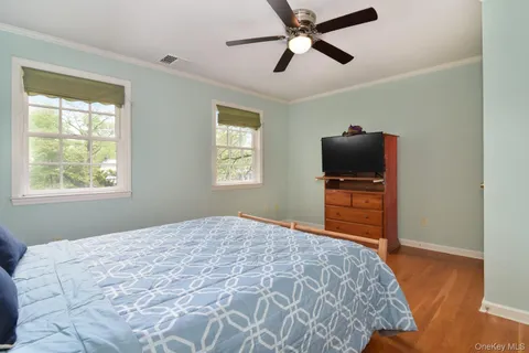 a bathroom with a toilet a sink and a mirror