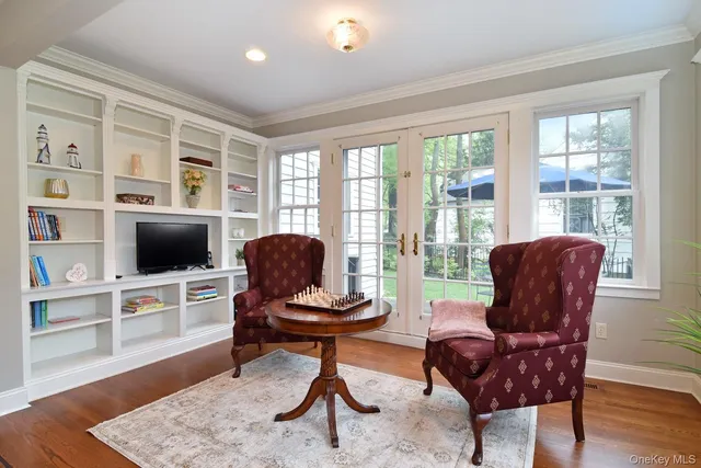 a living room with furniture fireplace and a flat screen tv