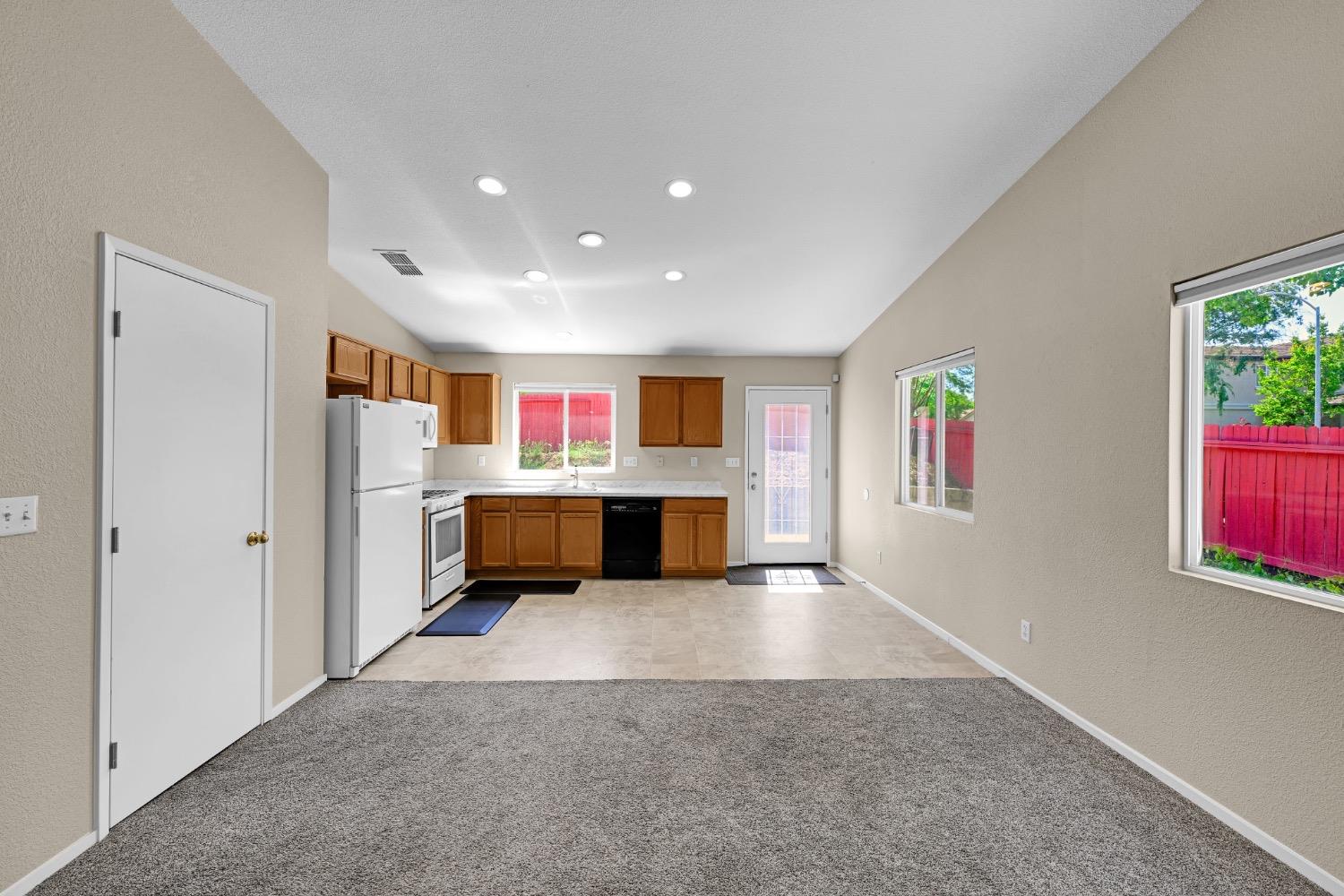 4627 Excelsior Road Mather, CA 95655 - Photo 11 of 33 a view of an empty room with kitchen view and a window