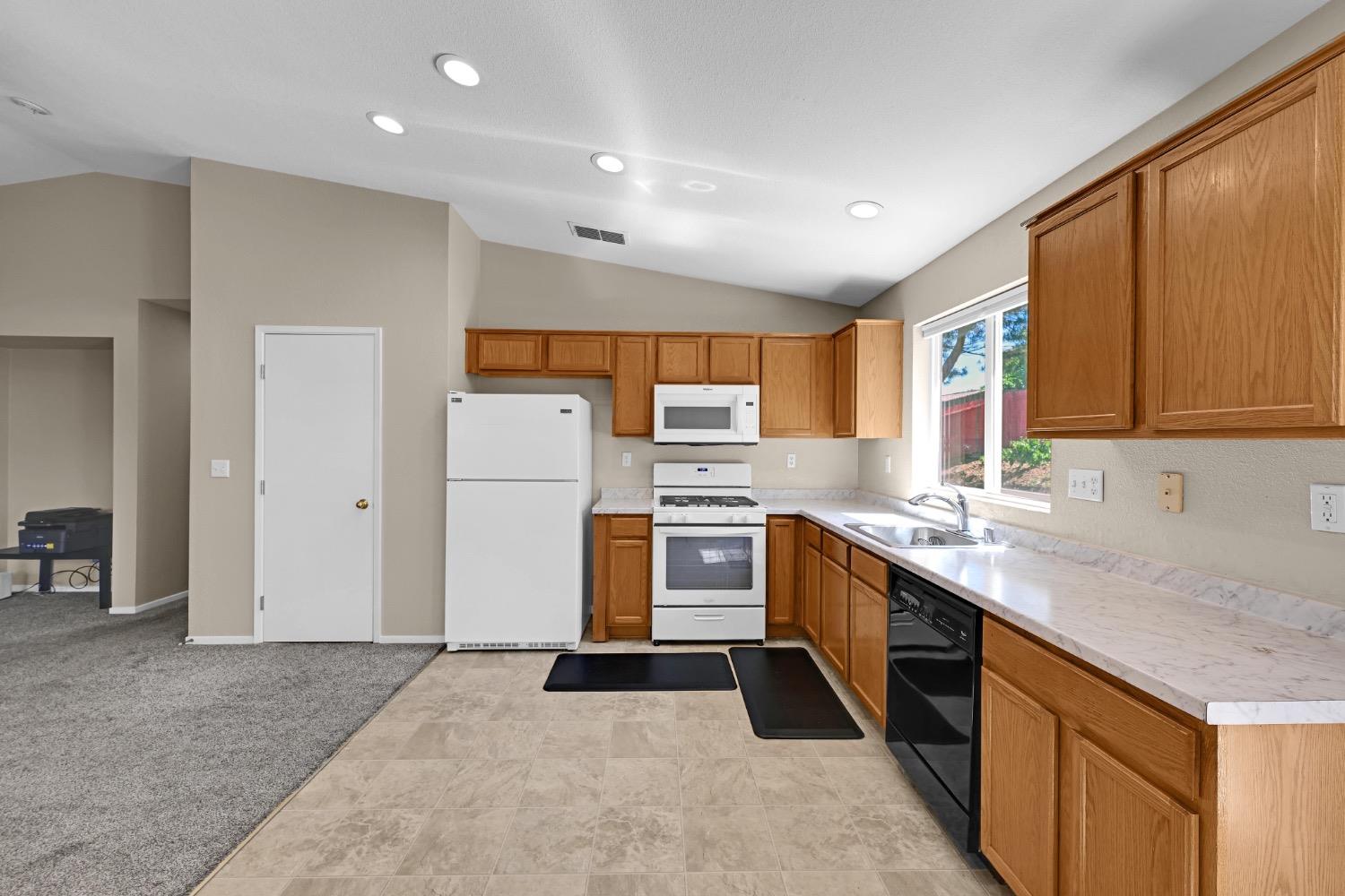 4627 Excelsior Road Mather, CA 95655 - Photo 13 of 33 a kitchen with a sink stove and refrigerator