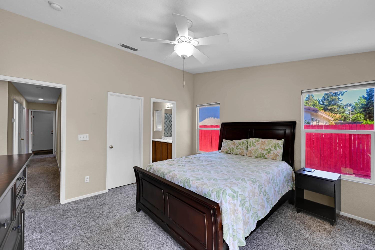 4627 Excelsior Road Mather, CA 95655 - Photo 18 of 33 a bedroom with a bed and a chandelier