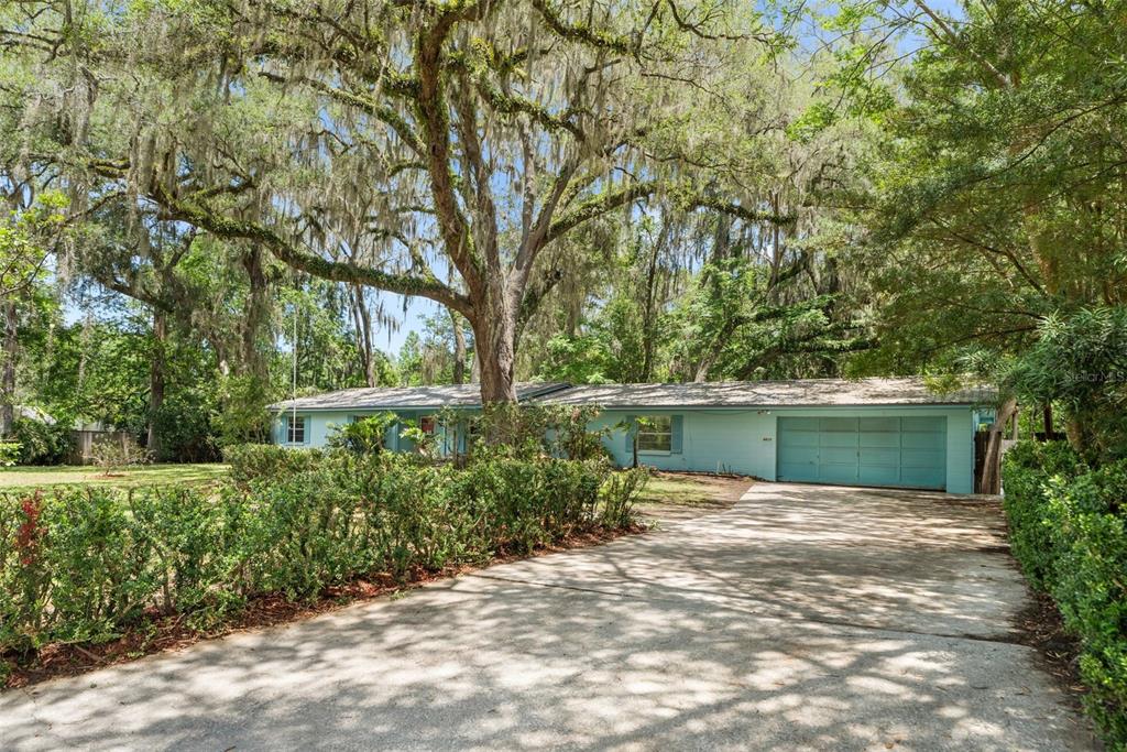 4825 Southwest 19th Street Gainesville, FL 32608 - Photo 32 of 40 a front view of a house with garden
