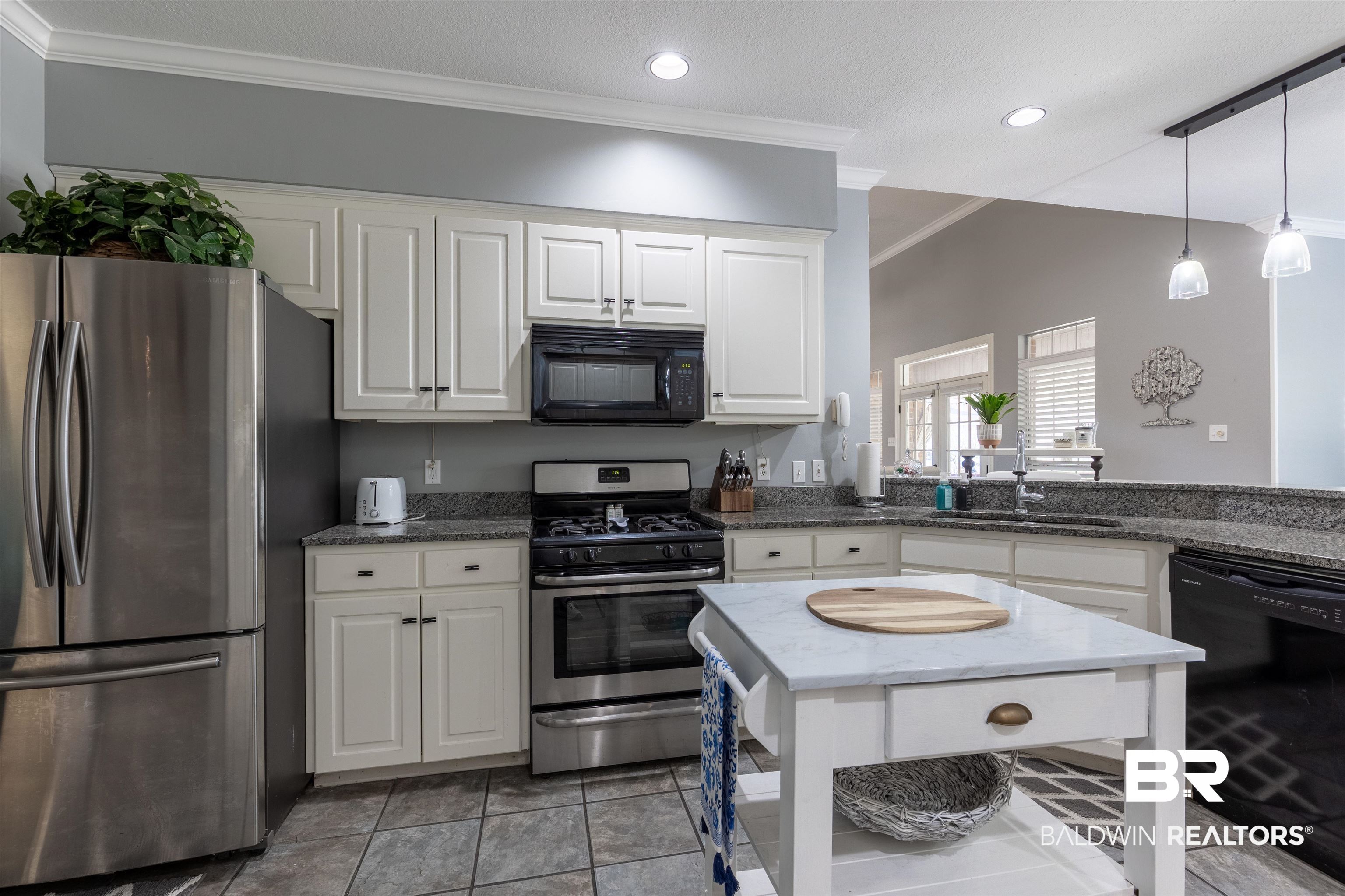 6436 Cherry Ridge Court West Mobile, AL 36695 - Photo 19 of 26 Kitchen with crown molding, a sink, black appliances, white cabinets, and decorative light fixtures