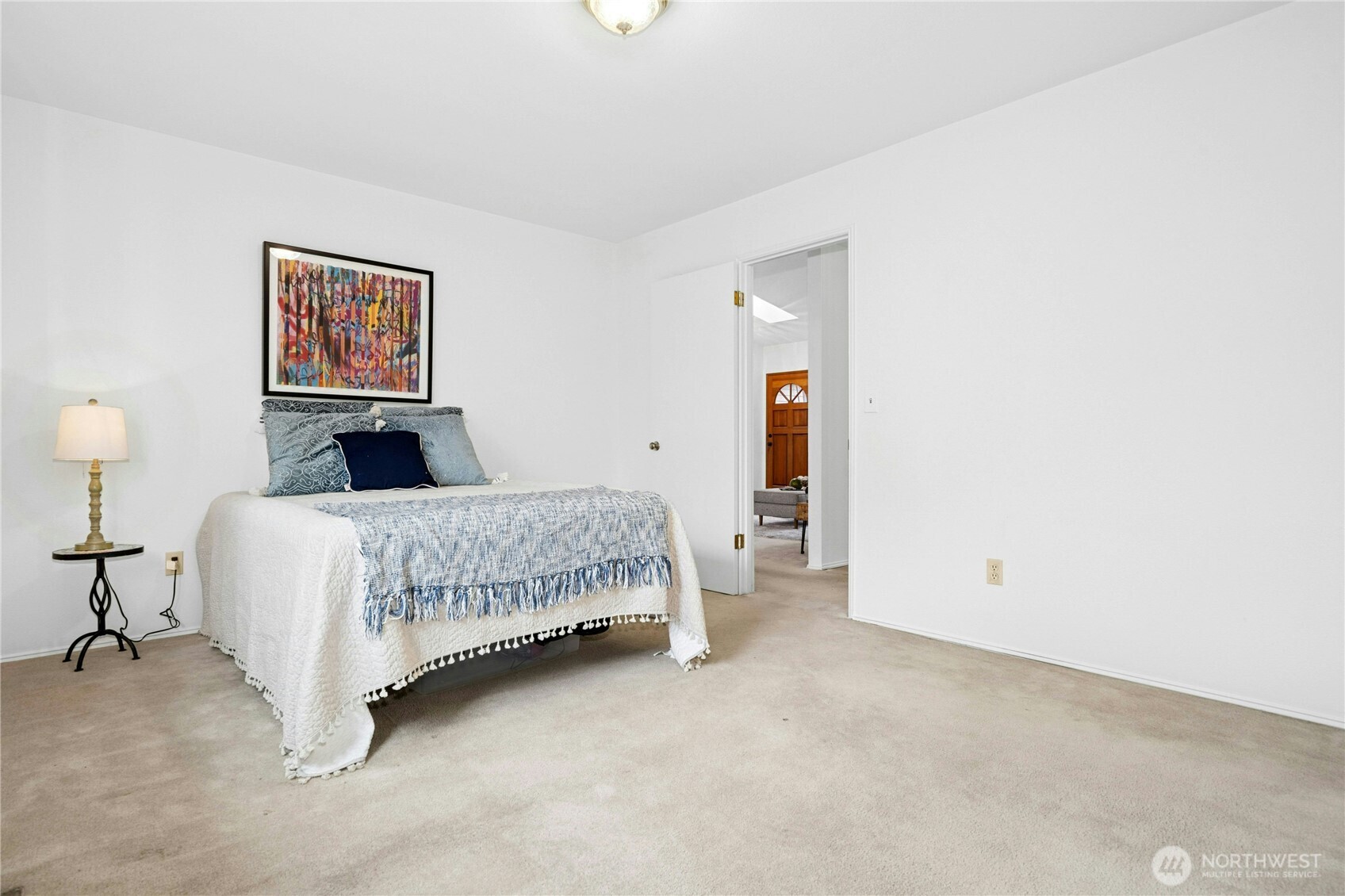 26603 199th Place Southeast Covington, WA 98042 - Photo 15 of 36 a bedroom with a bed and a painting on the wall