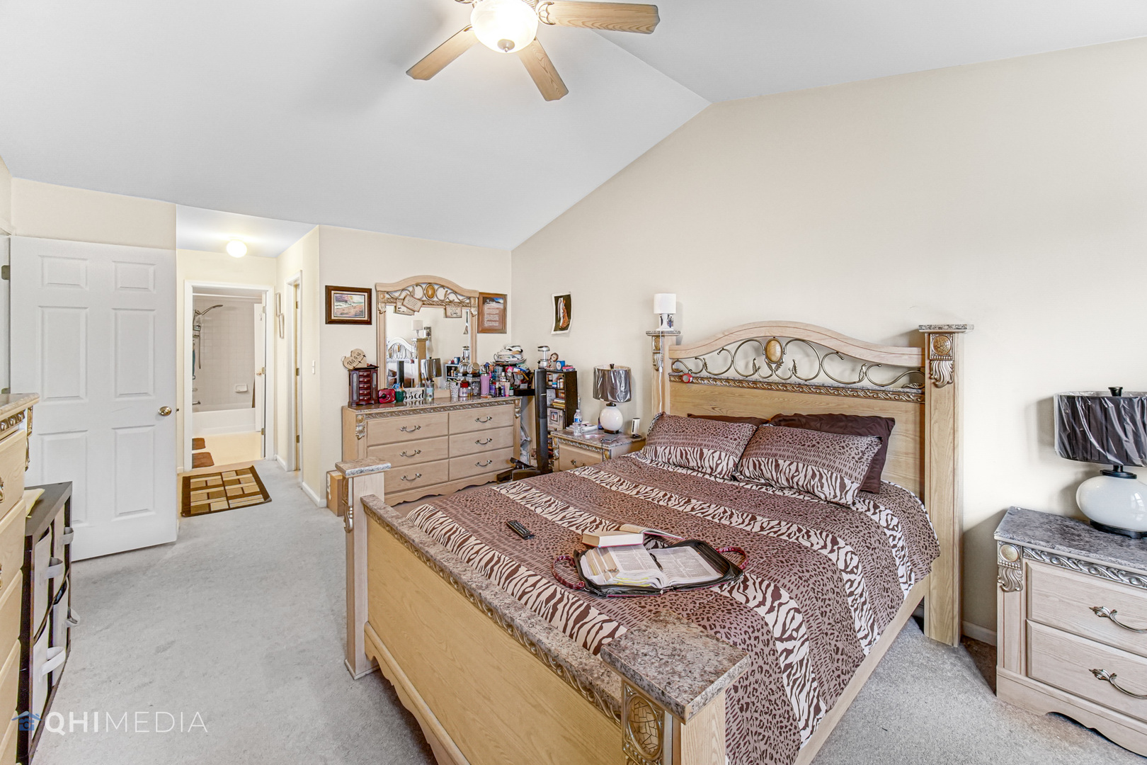 3415 Huntley Terrace, Unit D Crete, IL 60417 - Photo 13 of 22 a bed sitting in a spacious bedroom next to a larger window