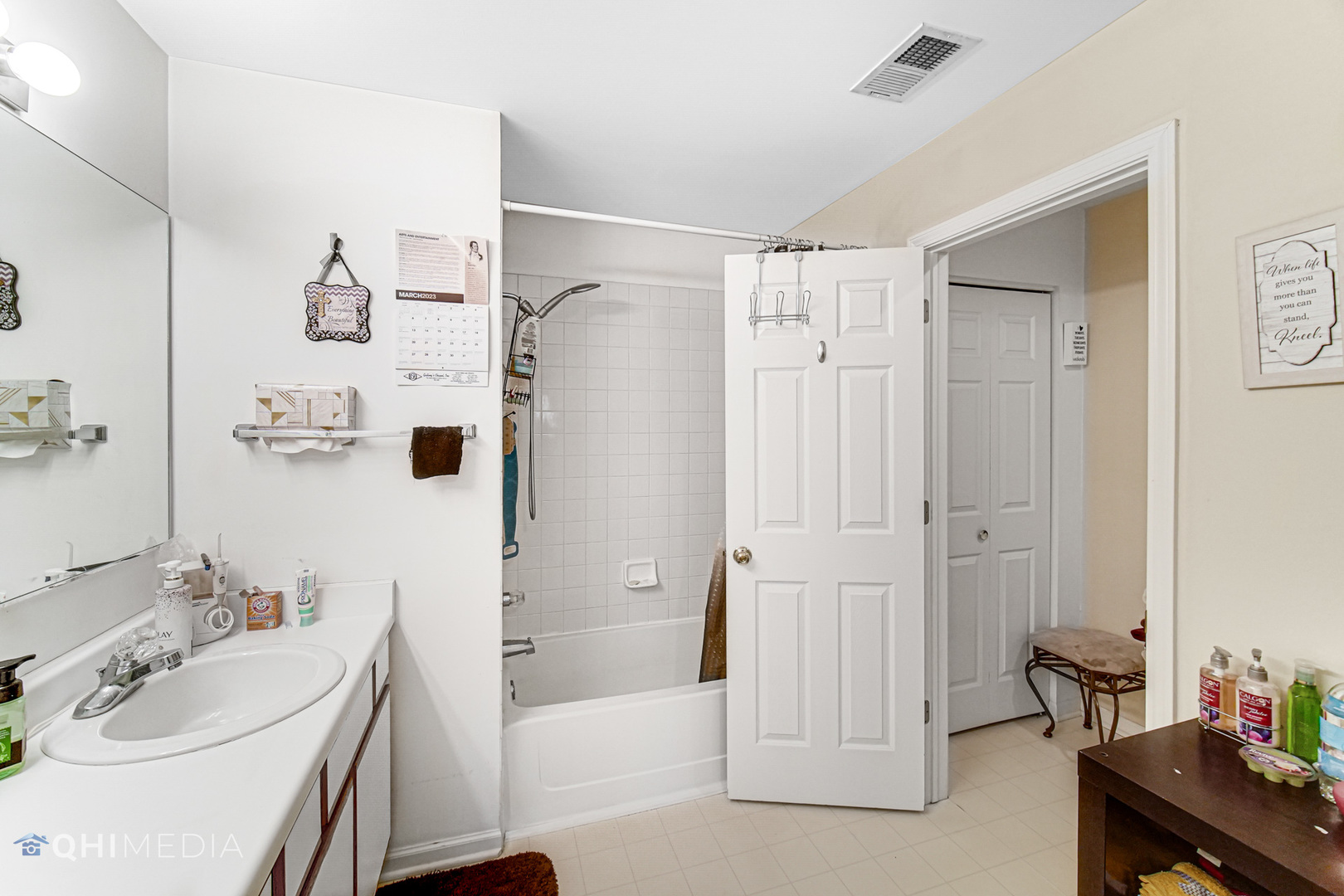 3415 Huntley Terrace, Unit D Crete, IL 60417 - Photo 16 of 22 a bathroom with a bathtub shower sink and toilet