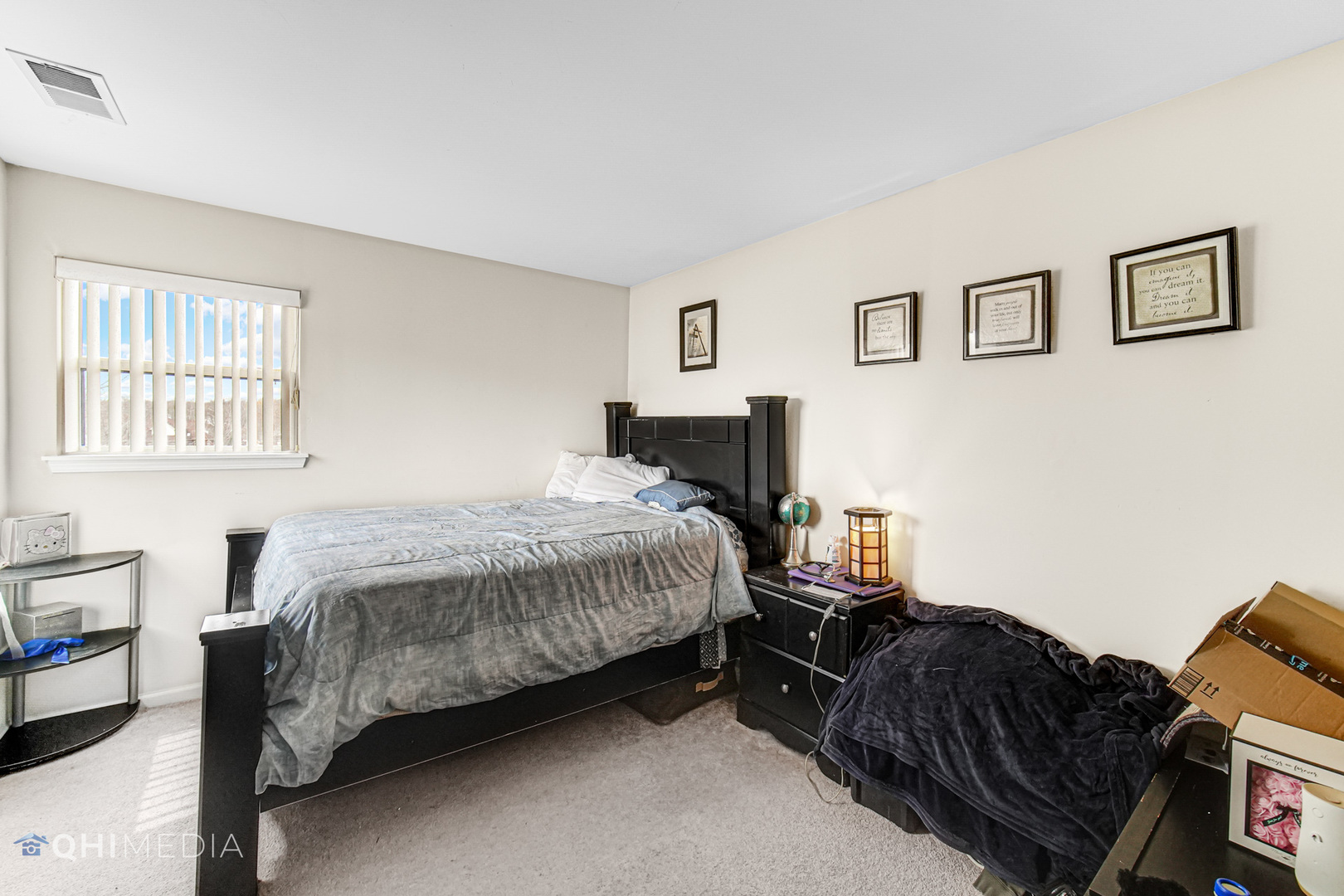 3415 Huntley Terrace, Unit D Crete, IL 60417 - Photo 17 of 22 a bedroom with a bed lamp and a window