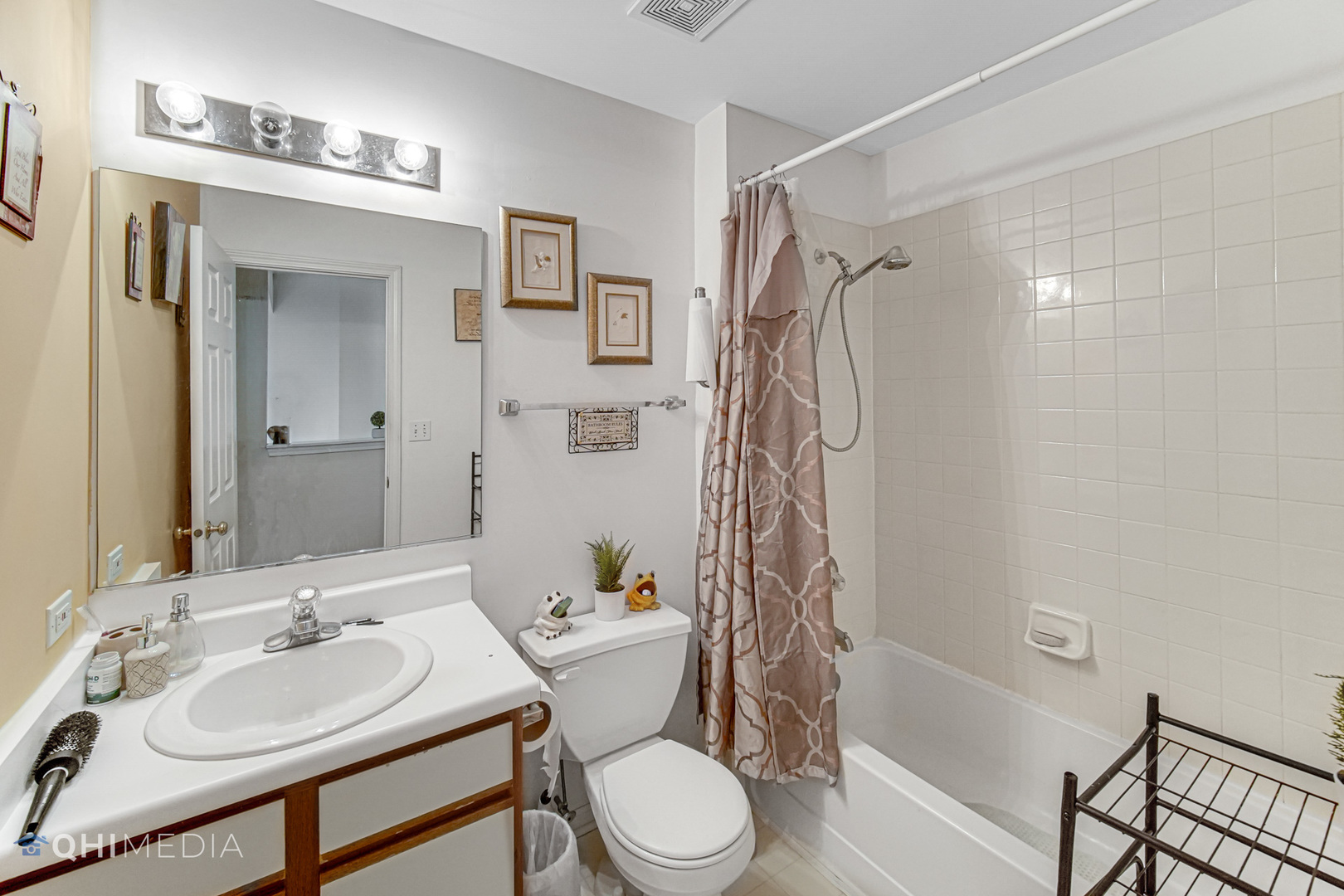 3415 Huntley Terrace, Unit D Crete, IL 60417 - Photo 18 of 22 a bathroom with a sink toilet and shower