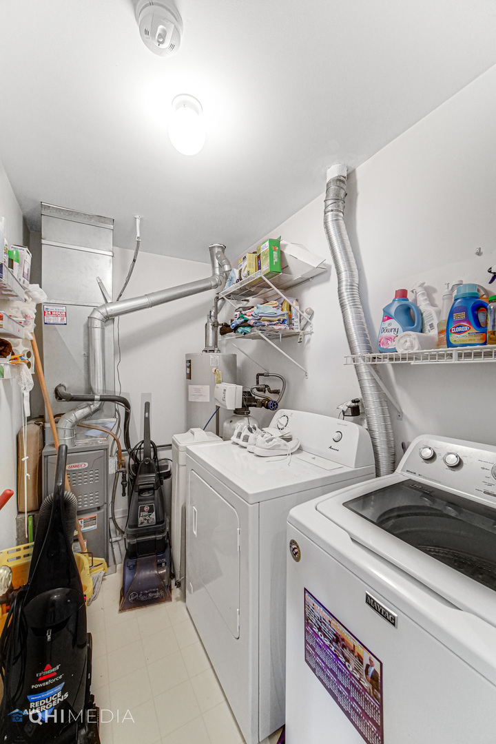 3415 Huntley Terrace, Unit D Crete, IL 60417 - Photo 19 of 22 a utility room with dryer and washer