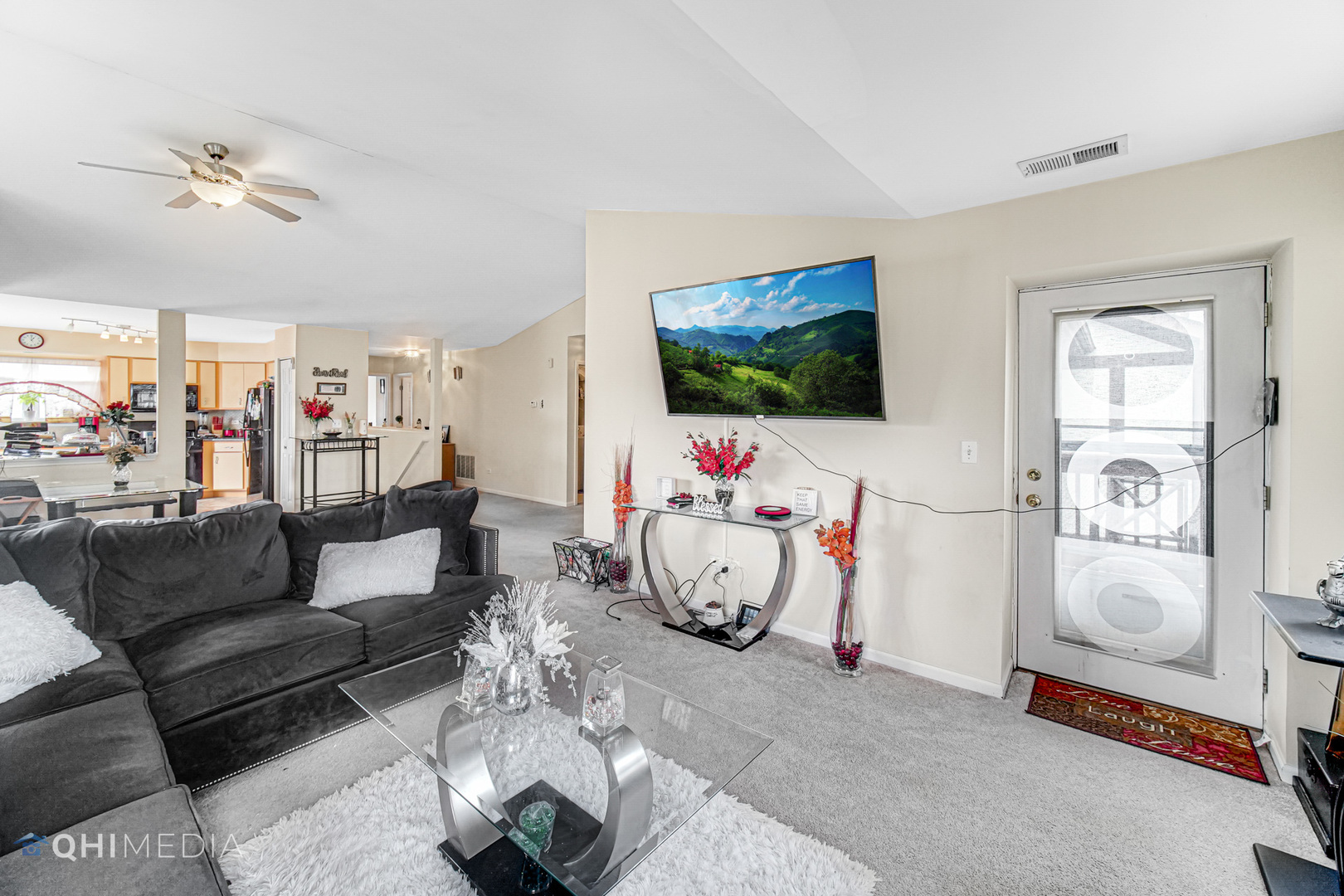 3415 Huntley Terrace, Unit D Crete, IL 60417 - Photo 8 of 22 a living room with furniture a flat screen tv and a window
