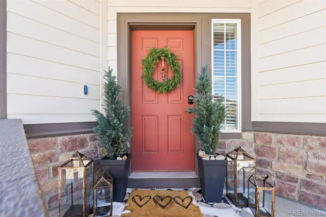 a view of an entryway with wooden floor