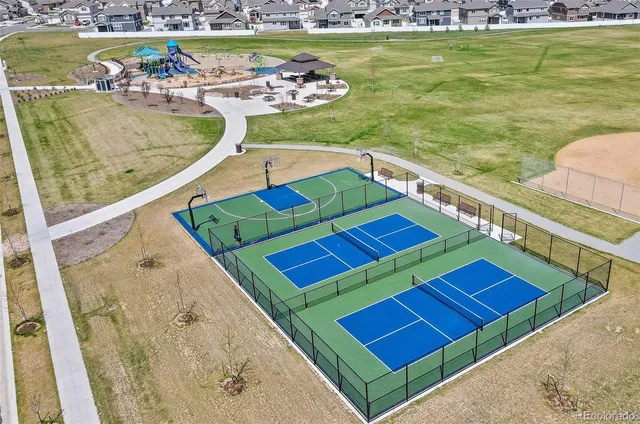 a view of a swimming pool with a table and chairs