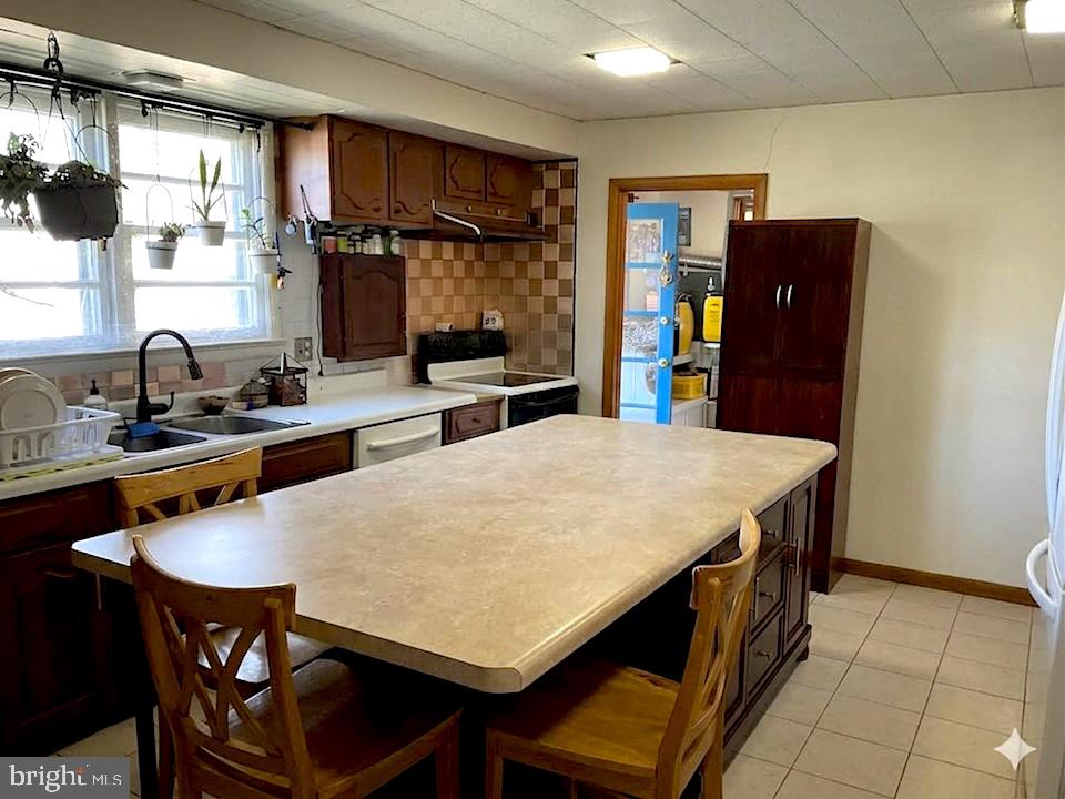 16080 Newbys Shop Road Elkwood, VA 22718 - Photo 5 of 21 a kitchen with stainless steel appliances granite countertop a sink and a refrigerator