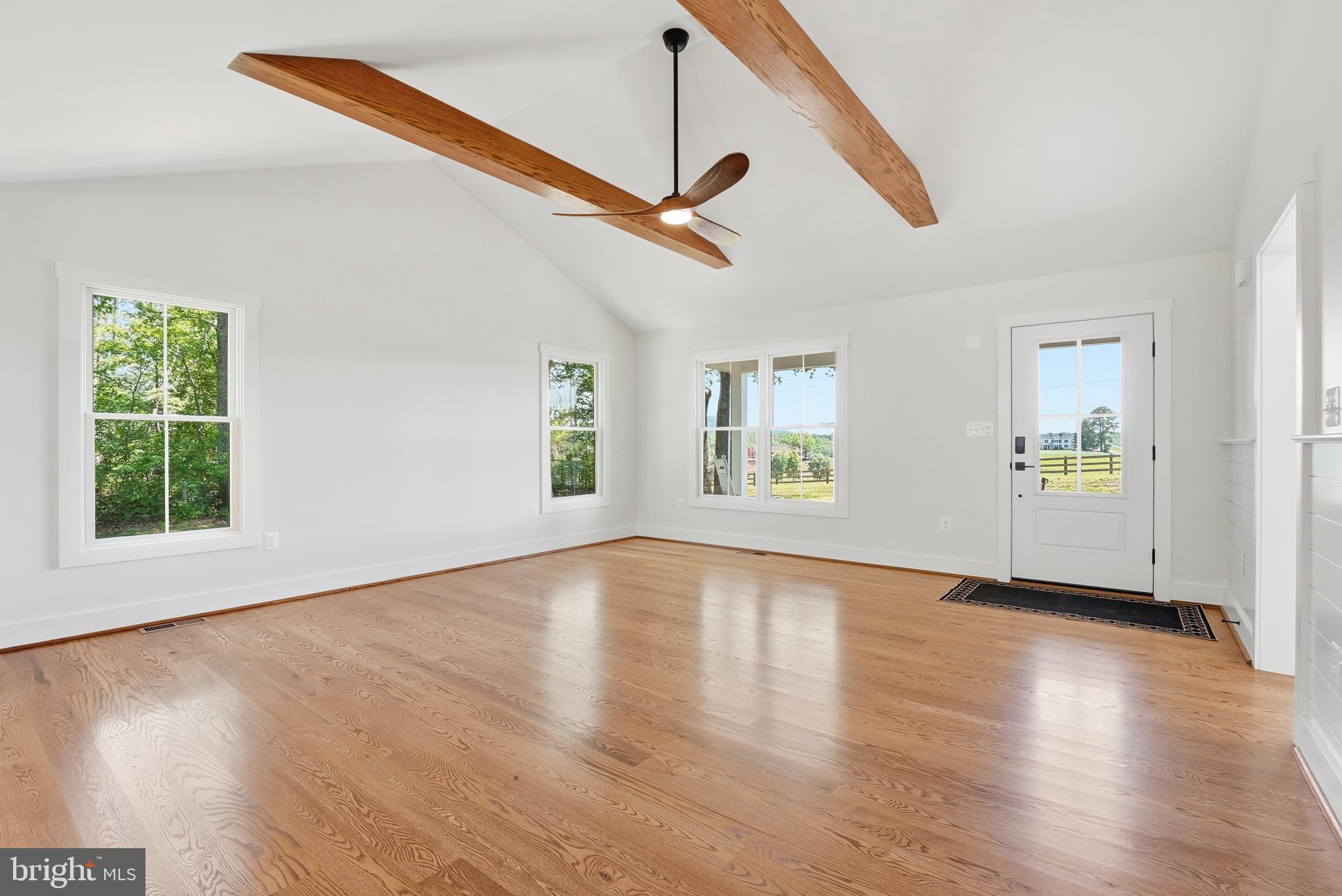 1548 James City Road Reva, VA 22735 - Photo 8 of 48 a view of an empty room with wooden floor and a window