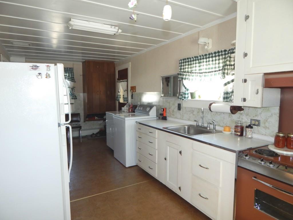 1263 Ayers Junction Road Charlotte, ME 04666 - Photo 13 of 33 Kitchen with laundry handy