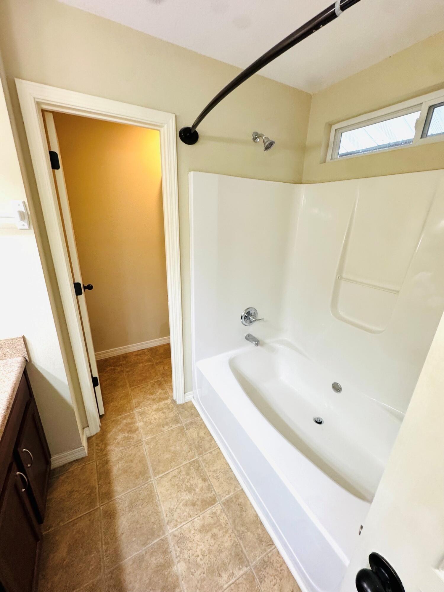 594 Hunters Ridge Road DeFuniak Springs, FL 32433 - Photo 10 of 17 a bathroom with a tub a sink and a shower