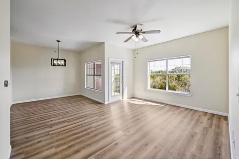 a view of a kitchen with wooden floor
