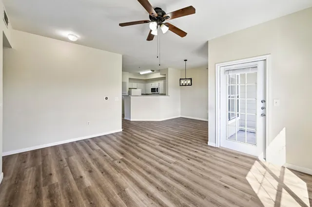 a view of a kitchen with wooden floor