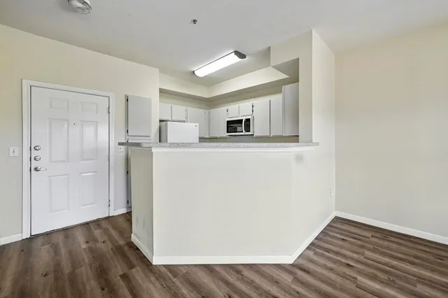 a kitchen with cabinets and appliances