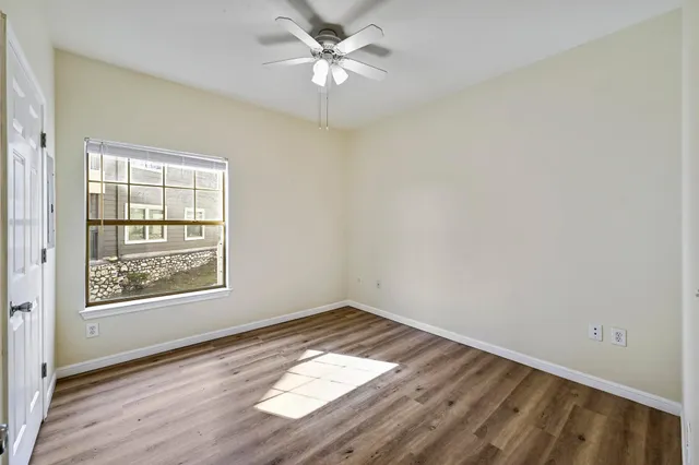 a front view of a room with racks on the wall