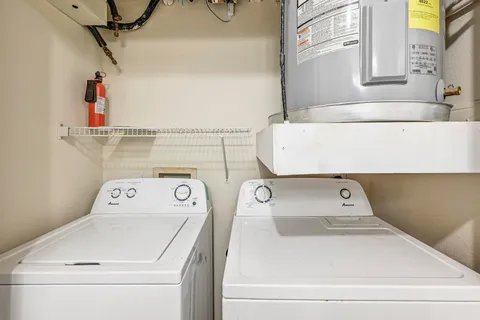 a brick building with a bench in front of it