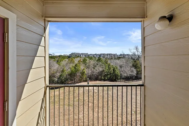 a brick building with a bench in front of it