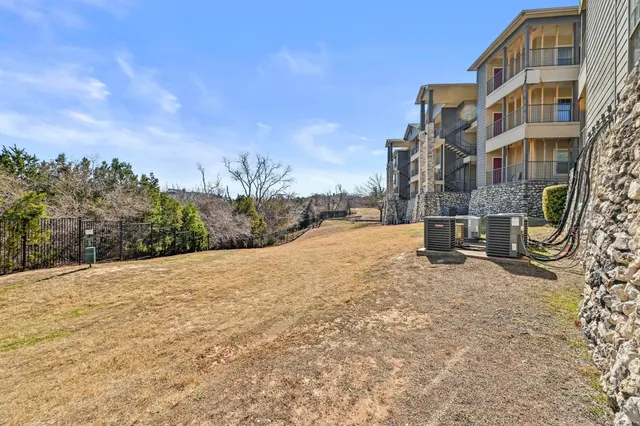 a white house with a large tree