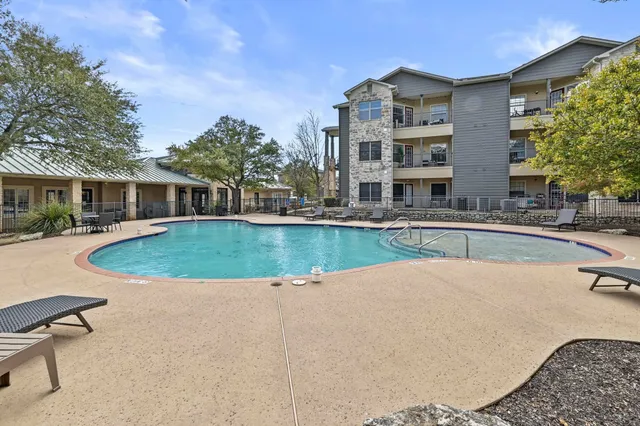 a view of a patio with table and chairs and potted plants