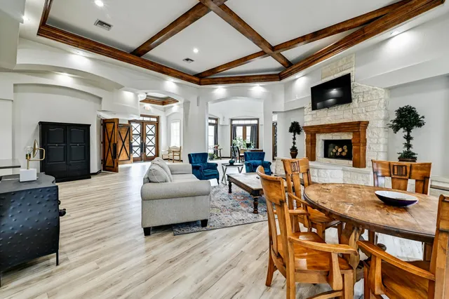 a kitchen with granite countertop a refrigerator stove and sink