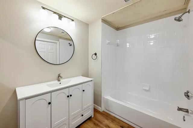 a bathroom with a sink and a mirror