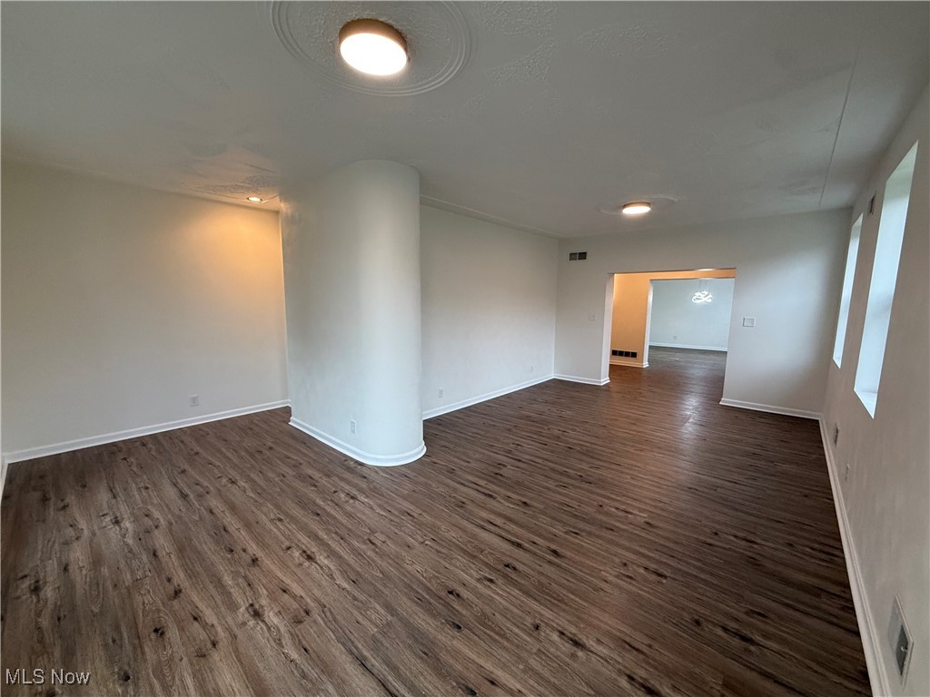 522 North 3rd Street Toronto, OH 43964 - Photo 5 of 47 Spare room with baseboards and dark wood-style flooring