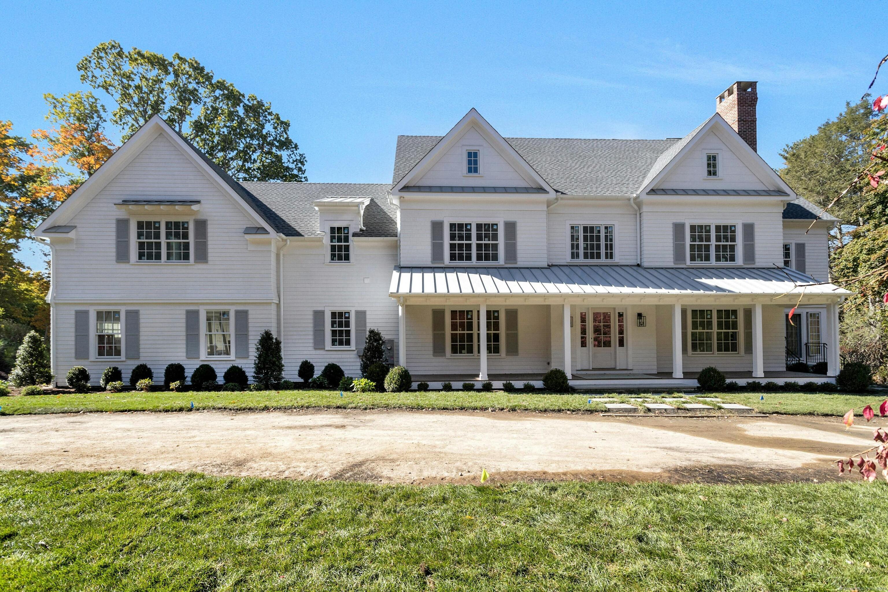 197 Carter Street New Canaan, CT 06840 - Photo 1 of 1 a front view of a house with a lots of plants