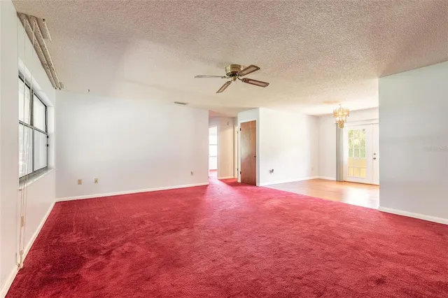 a bedroom with bed and wooden floor