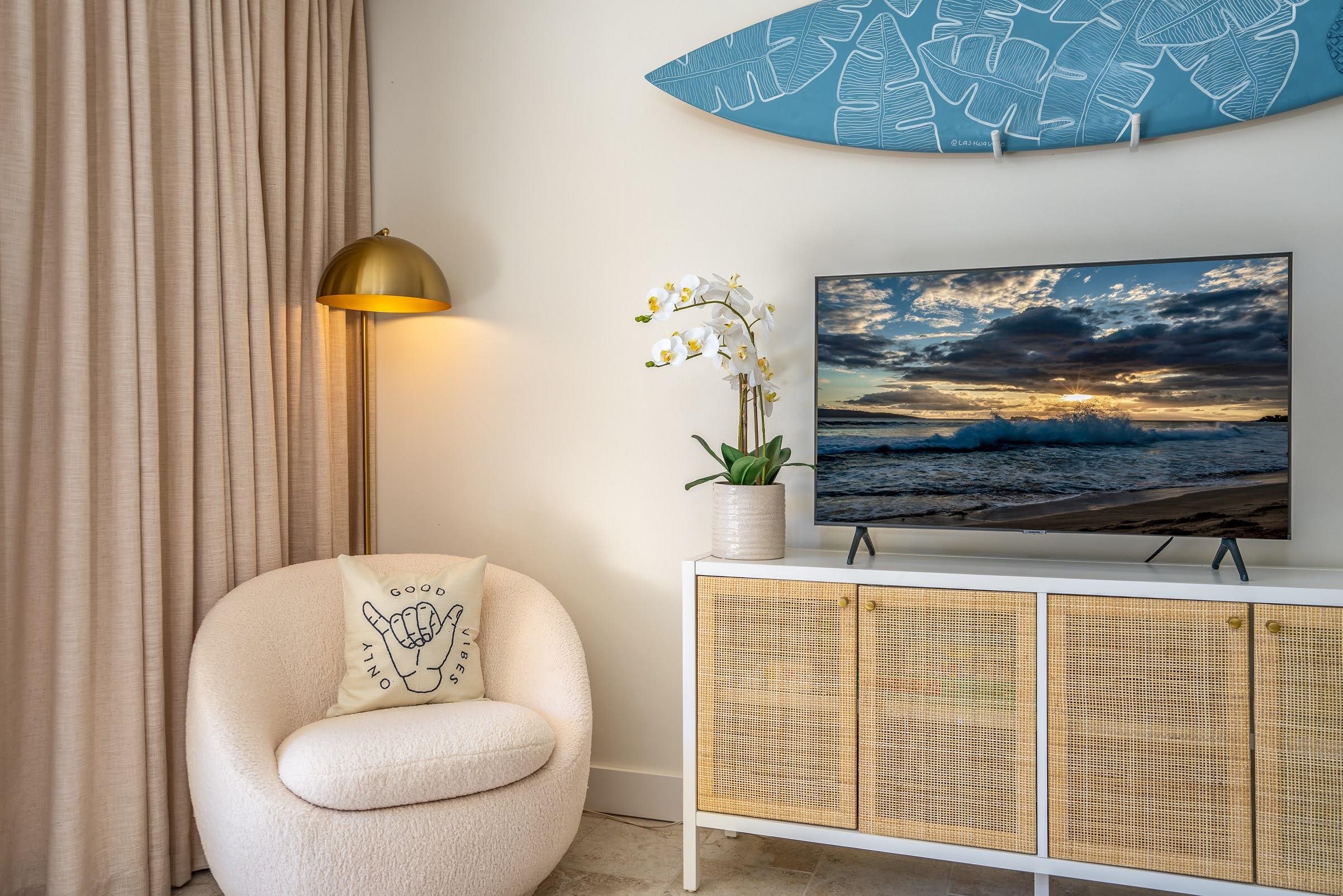 145 North Kihei Road, Unit 103 Kihei, HI 96753 - Photo 12 of 49 a living room with furniture and a flat screen tv