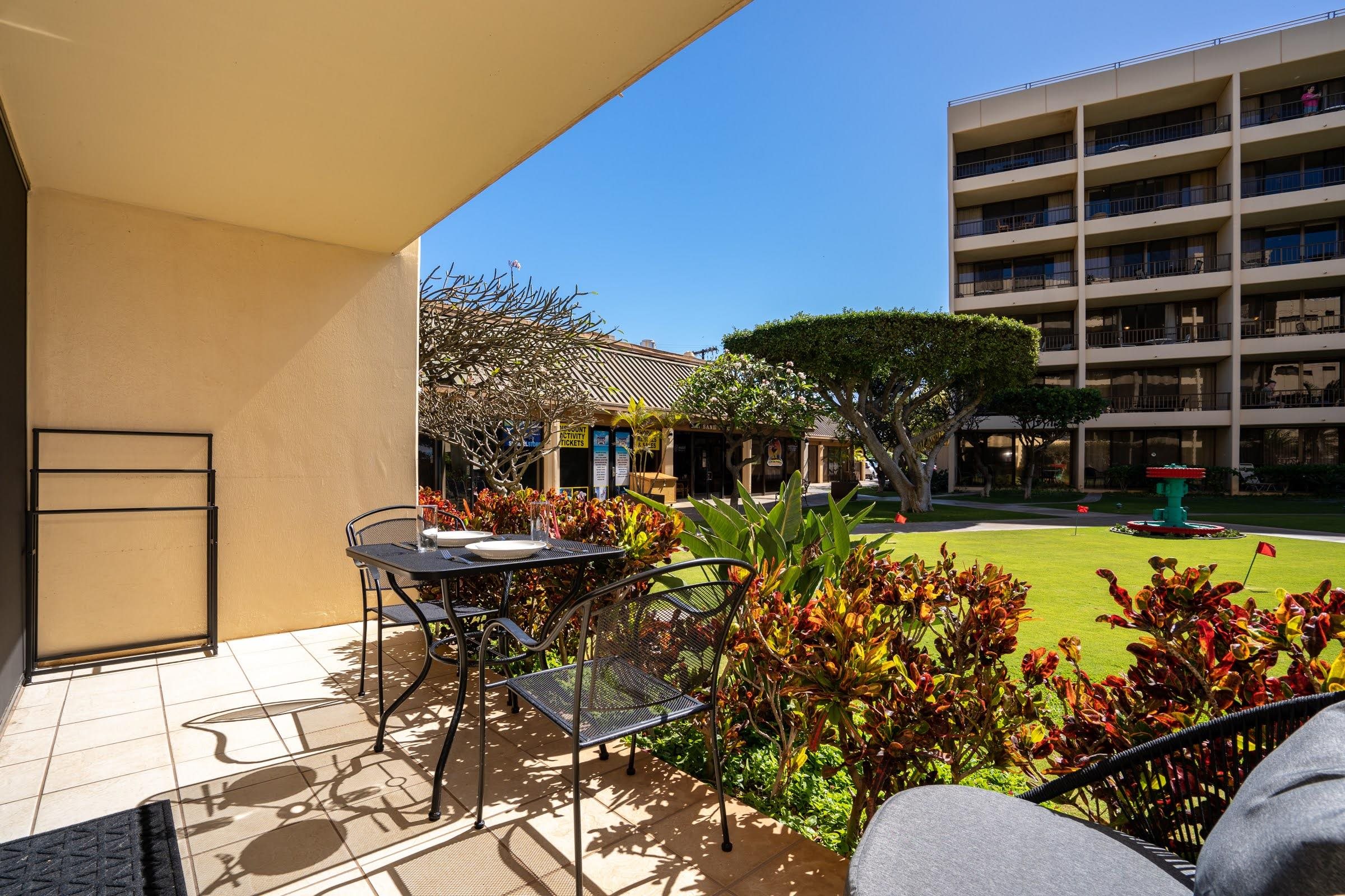145 North Kihei Road, Unit 103 Kihei, HI 96753 - Photo 29 of 49 a view of a chairs and table in the patio