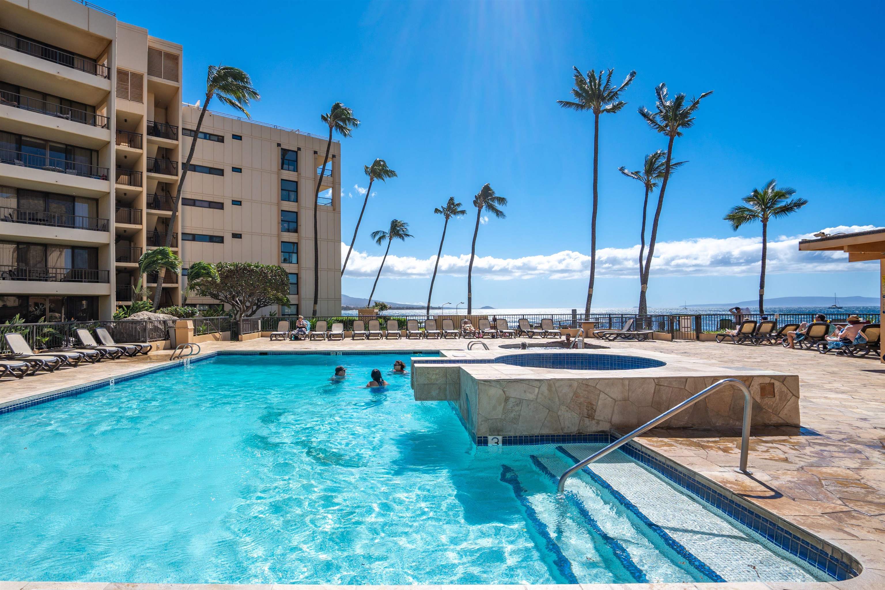 145 North Kihei Road, Unit 103 Kihei, HI 96753 - Photo 35 of 49 a view of a swimming pool with chairs