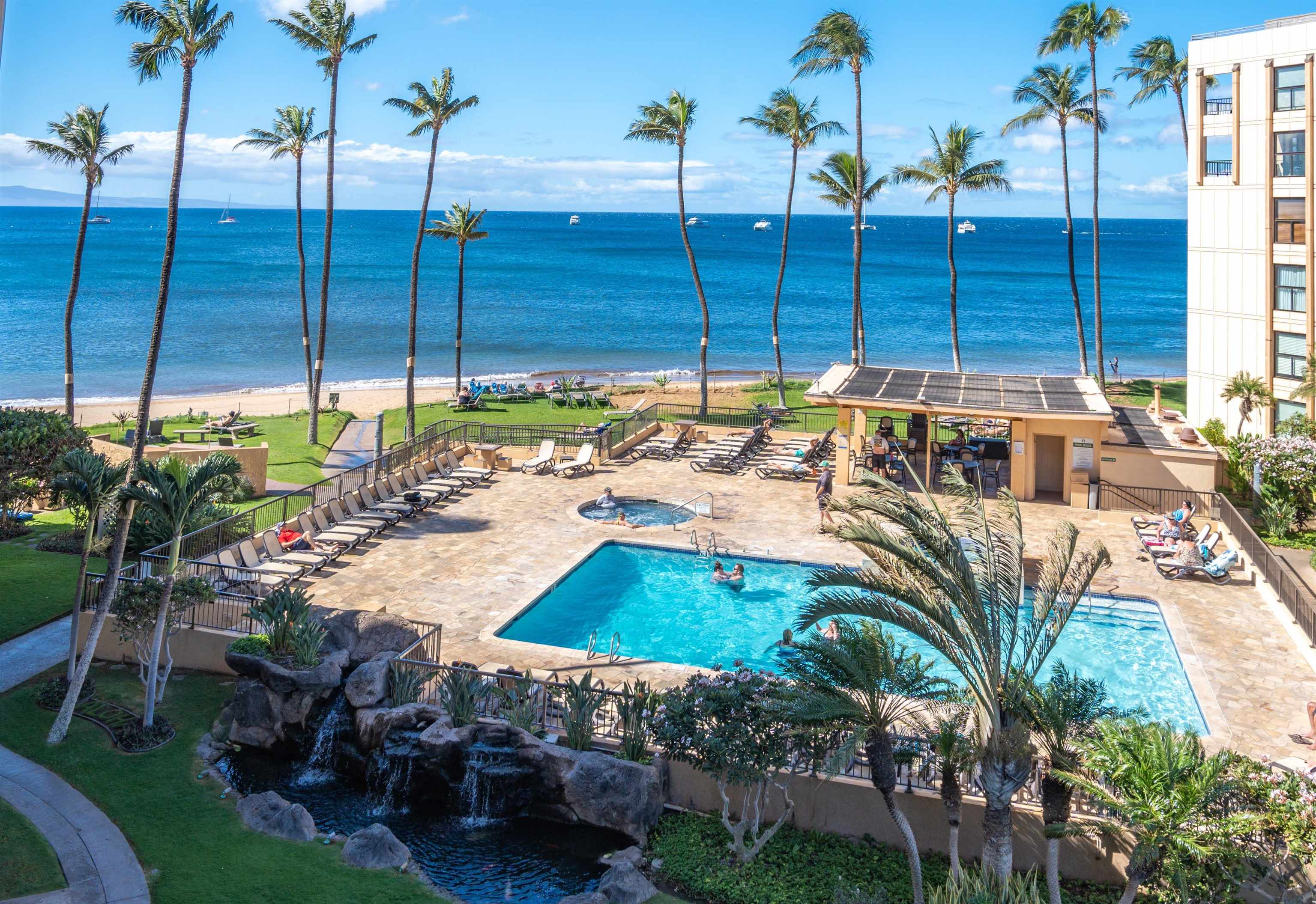 145 North Kihei Road, Unit 103 Kihei, HI 96753 - Photo 36 of 49 a view of a chairs and table in the patio