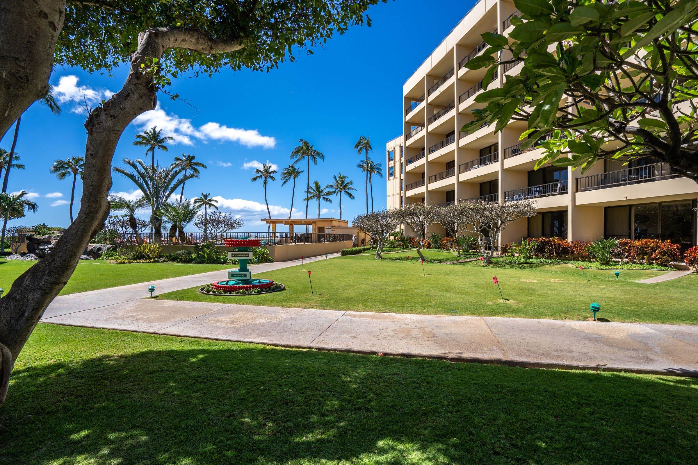 145 North Kihei Road, Unit 103 Kihei, HI 96753 - Photo 41 of 49 a view of a big building with a yard