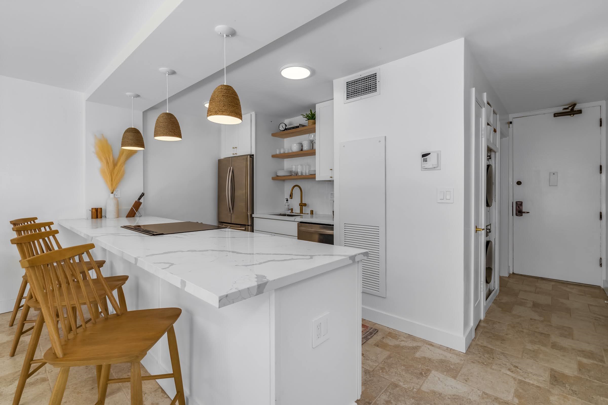 145 North Kihei Road, Unit 103 Kihei, HI 96753 - Photo 6 of 49 a view of kitchen island with cabinets