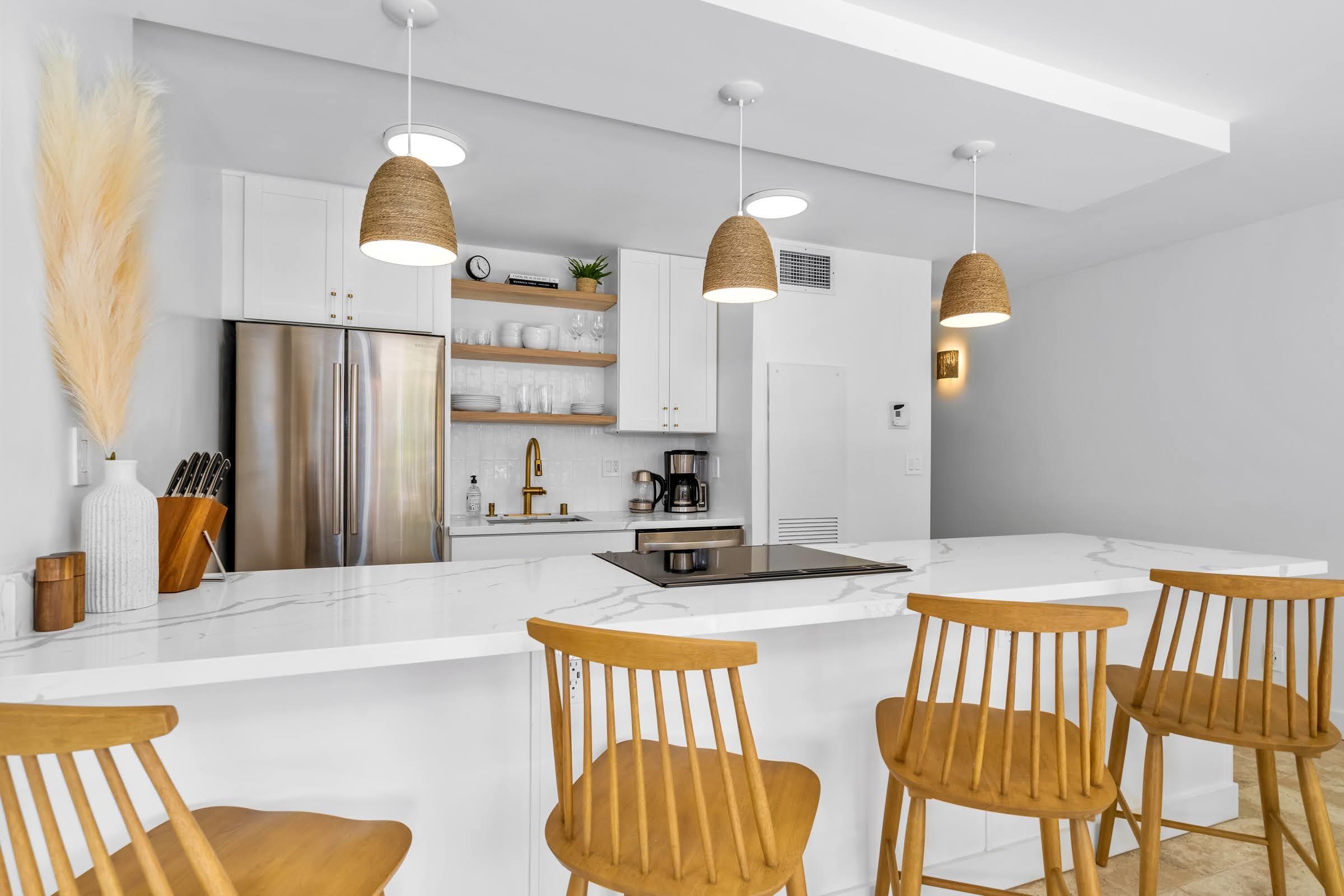 145 North Kihei Road, Unit 103 Kihei, HI 96753 - Photo 7 of 49 a kitchen with a sink appliances and cabinets