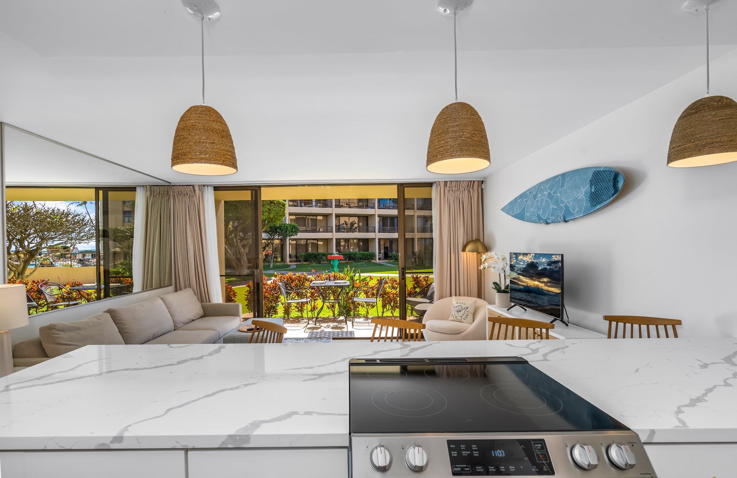 145 North Kihei Road, Unit 103 Kihei, HI 96753 - Photo 8 of 49 a living room with furniture and a large window