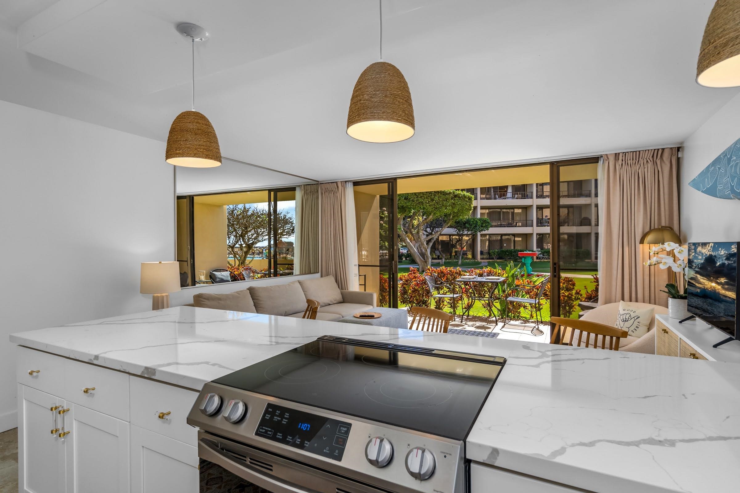 145 North Kihei Road, Unit 103 Kihei, HI 96753 - Photo 9 of 49 a living room with furniture and a floor to ceiling window