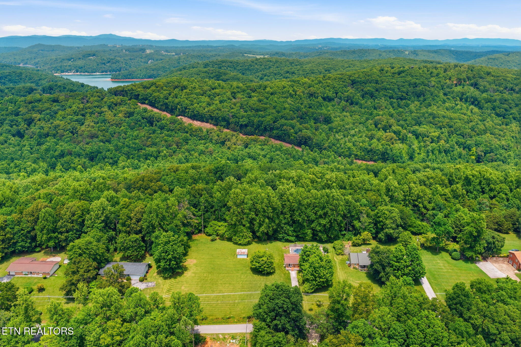 815 Stephens Road Rocky Top, TN 37769 - Photo 3 of 33 52-web-or-mls-DJI_20260529134753_0440_D