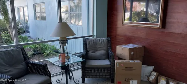 a view of a balcony with furniture