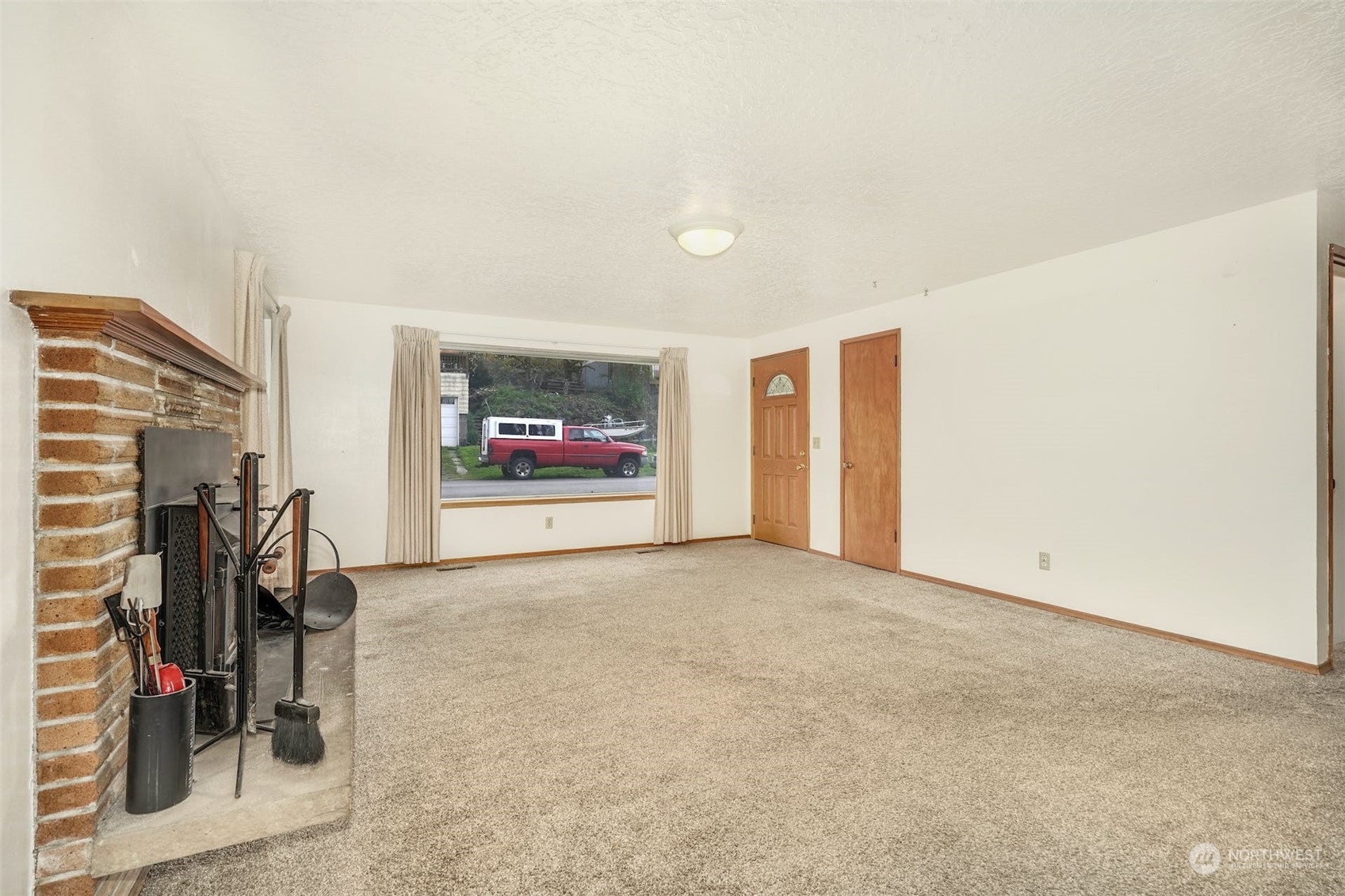 4151 23rd Avenue Southwest Seattle, WA 98106 - Photo 11 of 36 a view of a livingroom with wooden floor and shoes